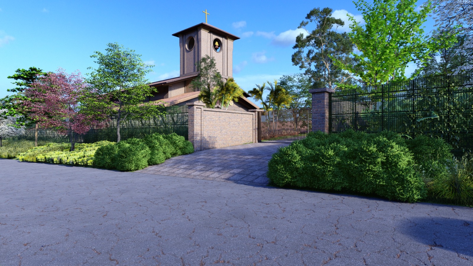 Entrada do Espaço Lisieux, com a torre do sino da capela e o jardim ao redor